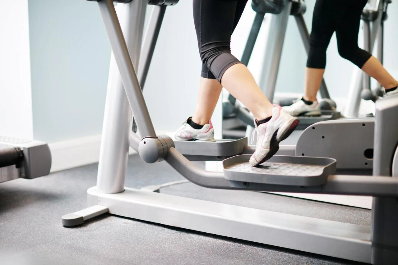 a woman walking on a treadmill in a gym at The Grand at Trafalgar Square in London